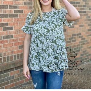 Sage green floral peplum top with cut out in back